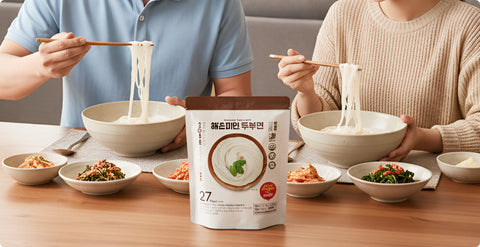 husband and wife eating haechomiin noodle together